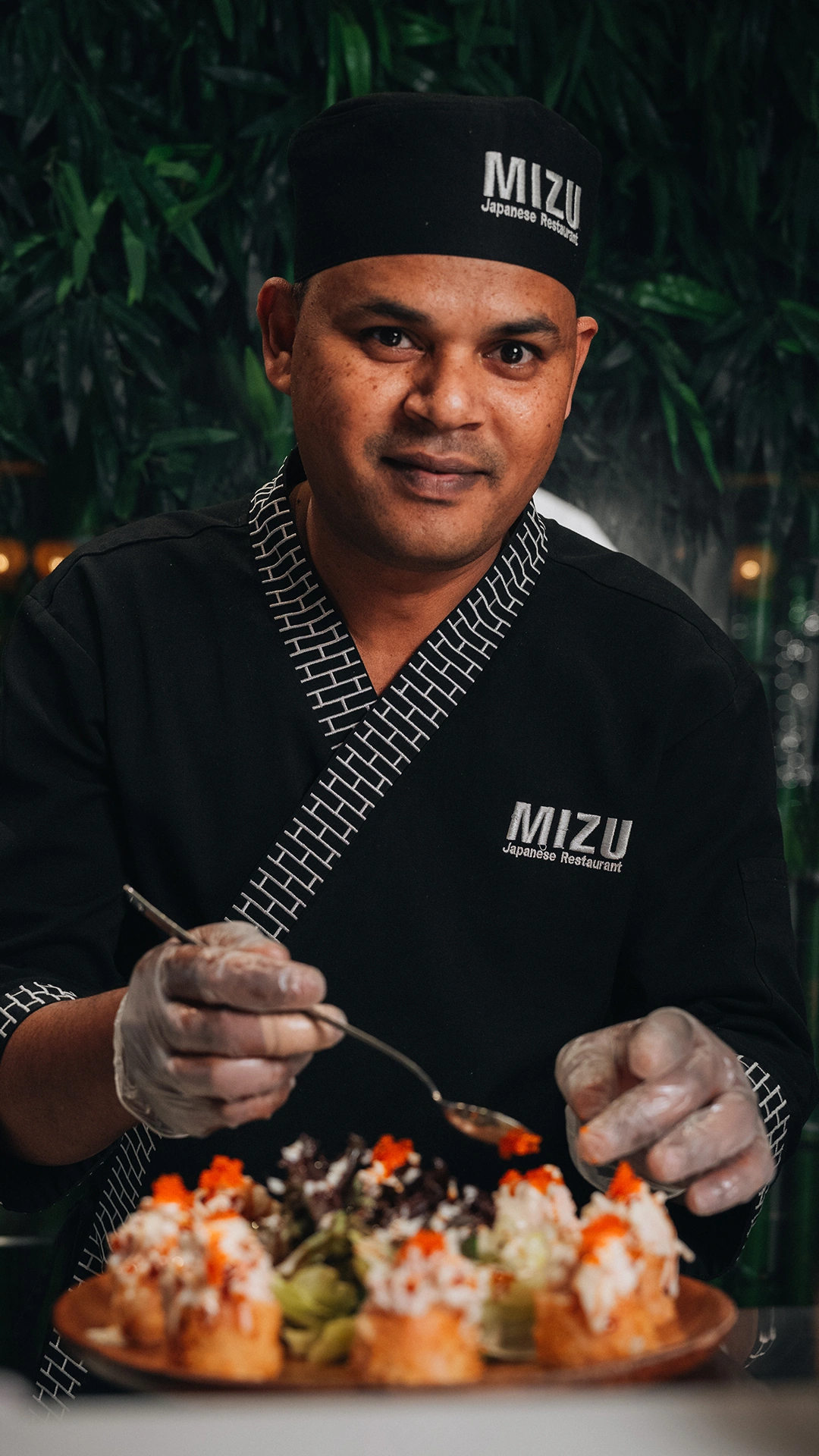 Mizu head chef preparing omakase nigiri with precise hand movements
