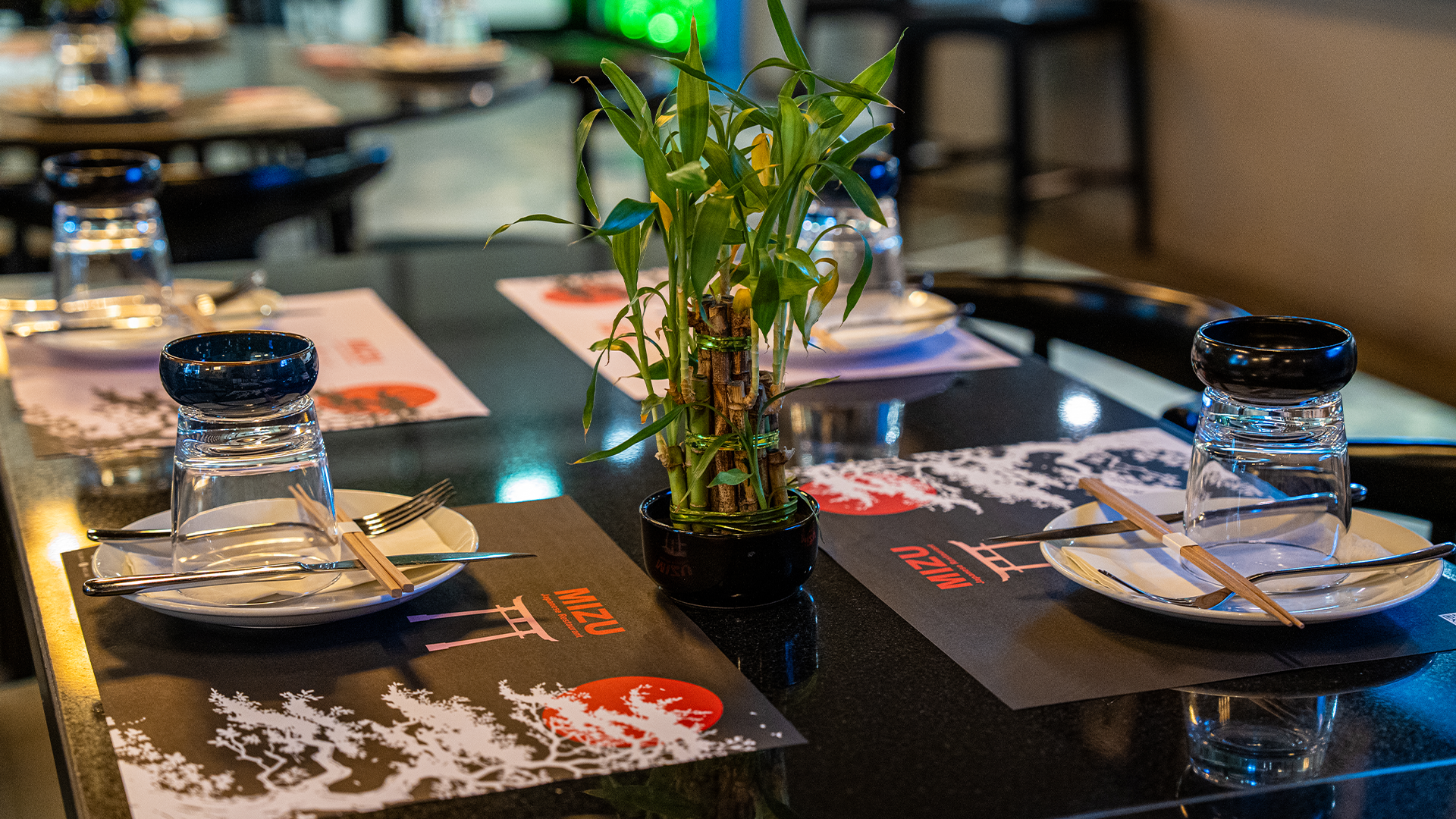 Mizu expanded omakase bar with warm ambient lighting